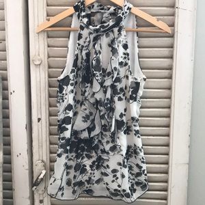 Black and white sleeveless blouse
